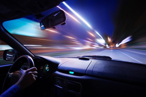 Car speeding at night in city