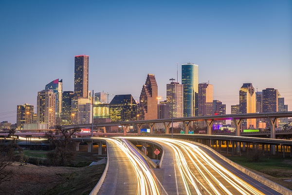 Houston, Texas, USA downtown city skyline and highway.