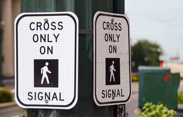Pedestrian signal for crossing street in downtown Houston, TX.