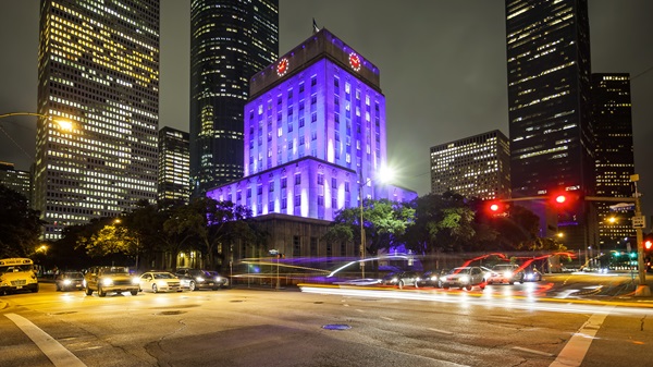 Houston City Hall building and traffic at night in downtown Houston, Texas